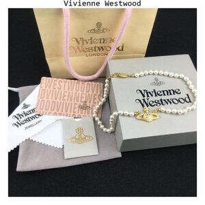 New Vivienne Westwood gold mini bas relief pendant necklace.
